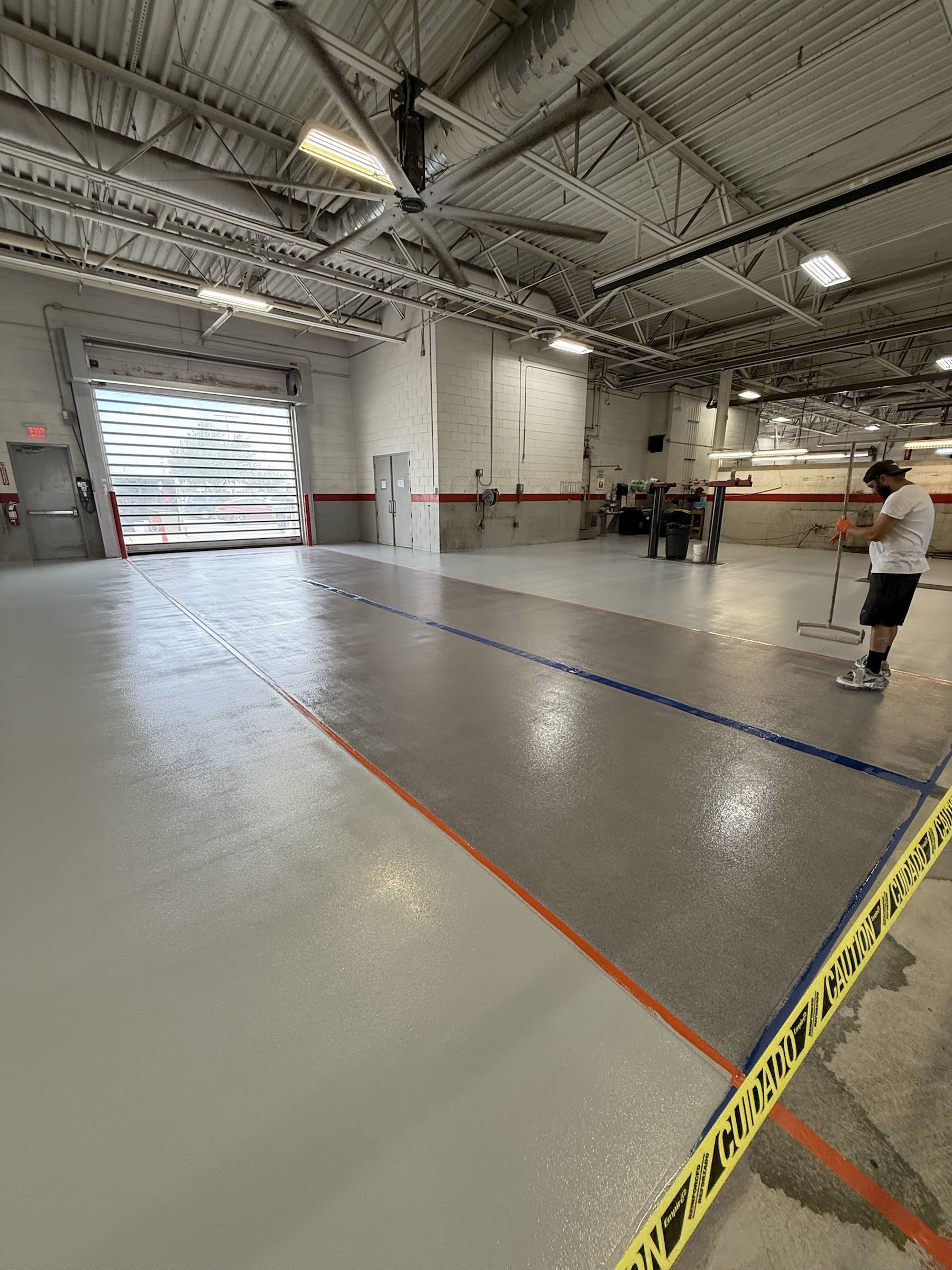 Gray Rezena Classic floor being finished in a commercial service facility