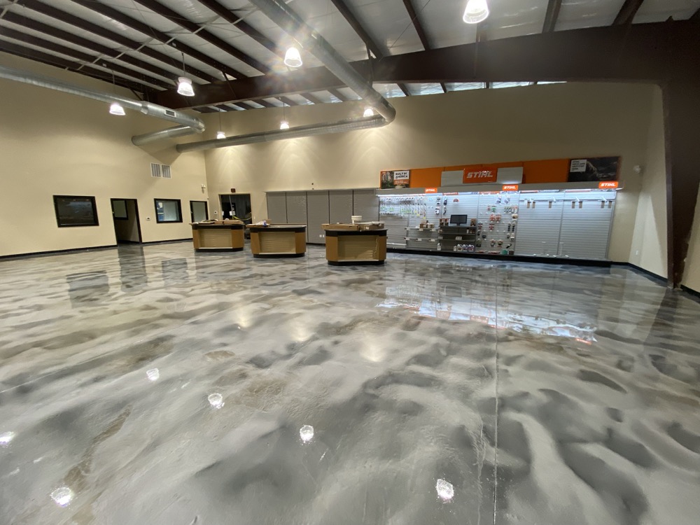 Finished silver and charcoal Rezena Metallic floor in a commercial showroom