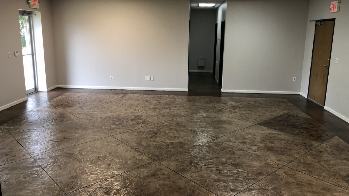 Finished brown PetraStamp floor with a textured stone pattern and decorative scoring